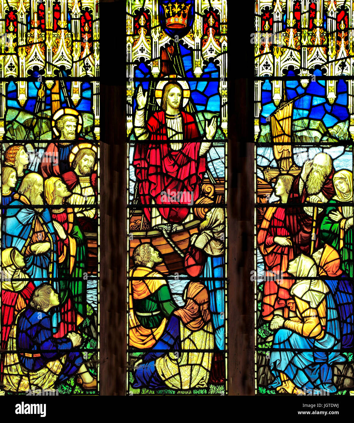 Jesus Christ, speaking, preaching, parables, from a fishing boat, stained glass window by J.Powell & sons, 1920, Saxlingham, Norfolk, England, UK Stock Photo