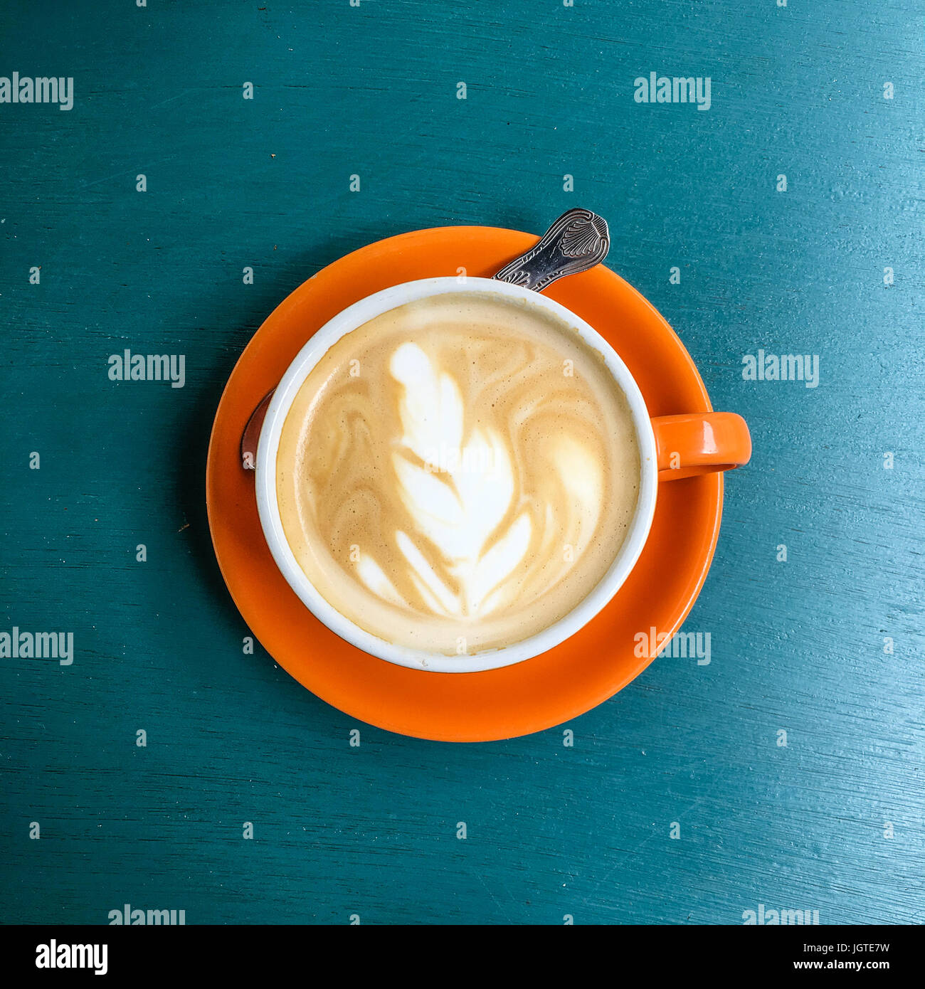 Cup of coffee on blue background Stock Photo - Alamy