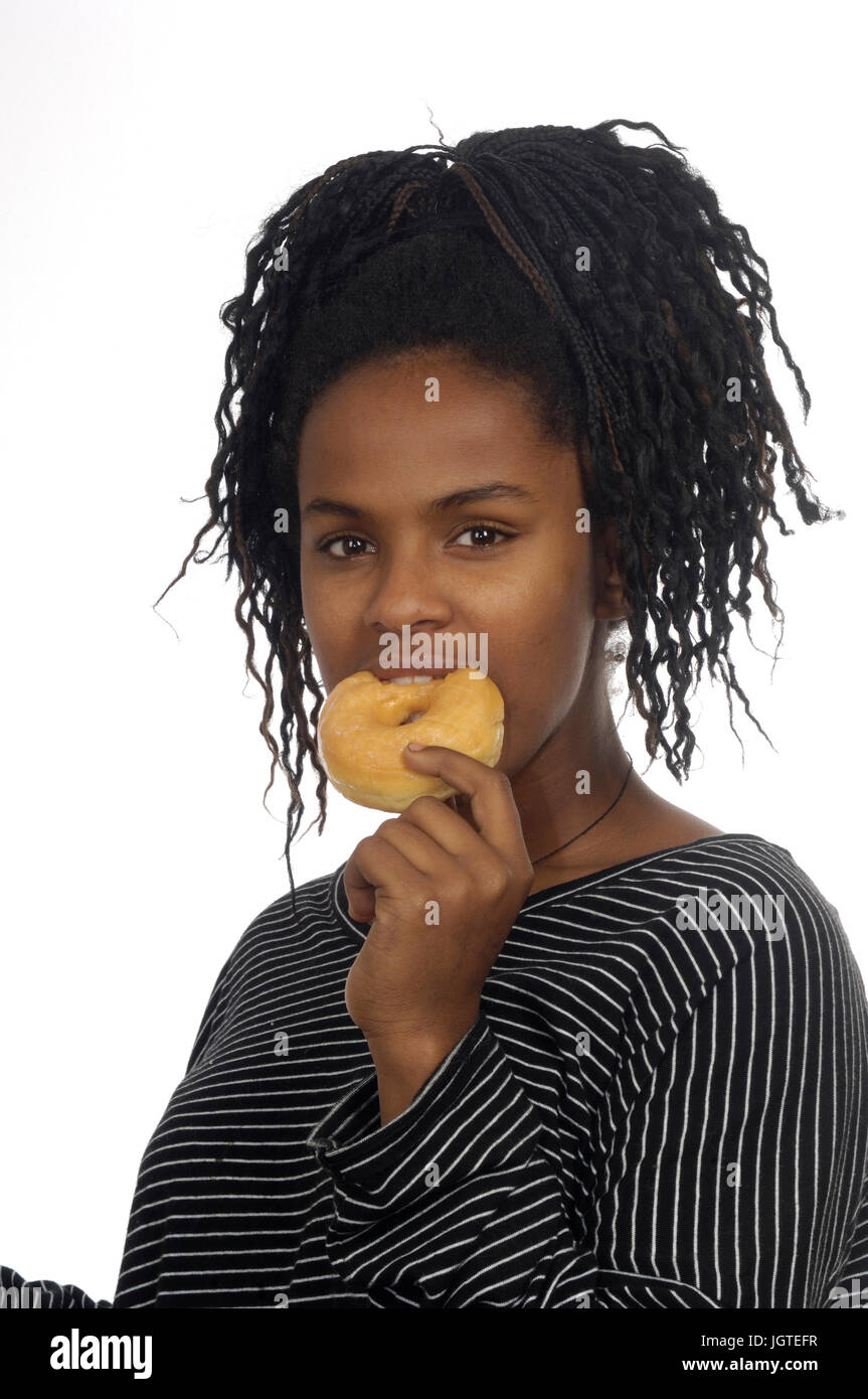 Teenager girl playing with a donut Stock Photo