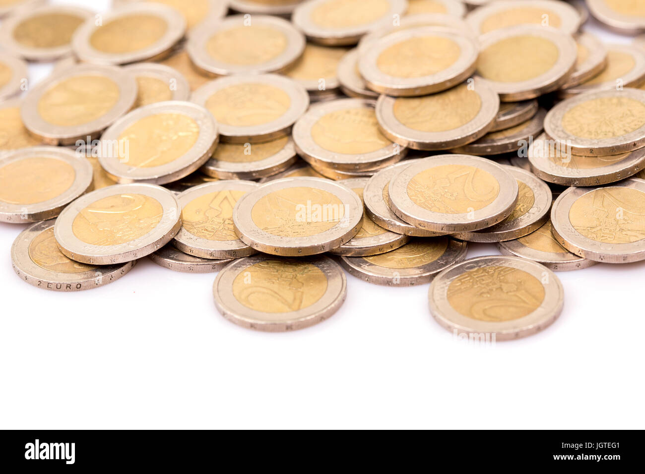 Heap of two euro coins isolated on white background Stock Photo - Alamy