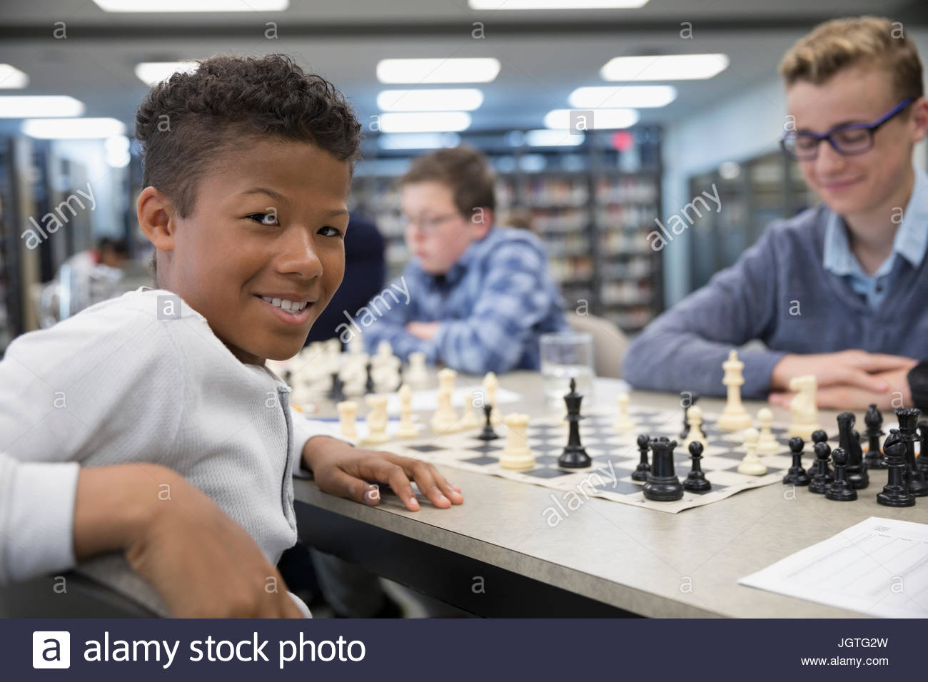 Boy learning chess piece knowledge and strategy hi-res stock ...