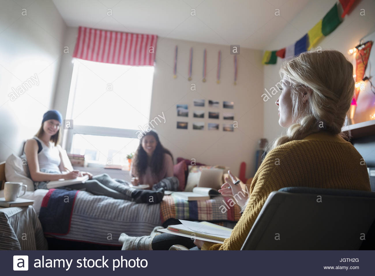 Female college students studying in dorm room Stock Photo