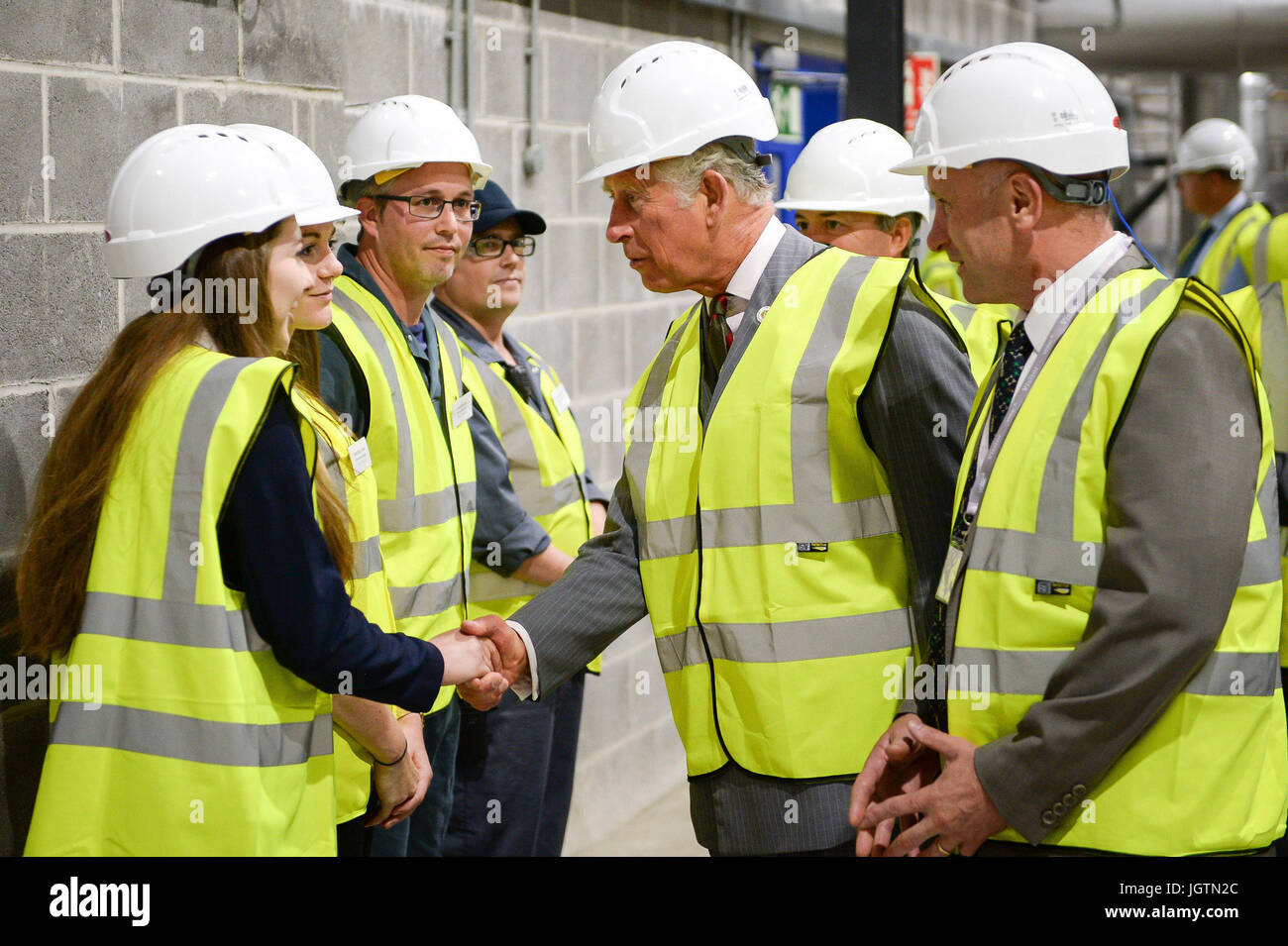 The Prince of Wales chats with Graduate Process Engineer Julia Pinches  during a visit to Volac International's new biomass plant in Ciliau Aeron,  which uses sustainable wood fuel to produce energy, before