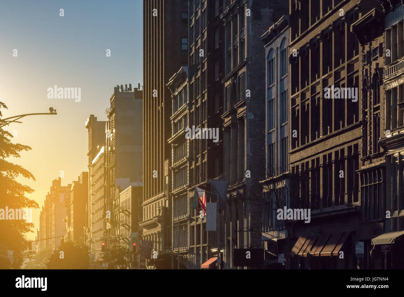 Sunset light shines on a block of buildings in New York City NYC Stock ...