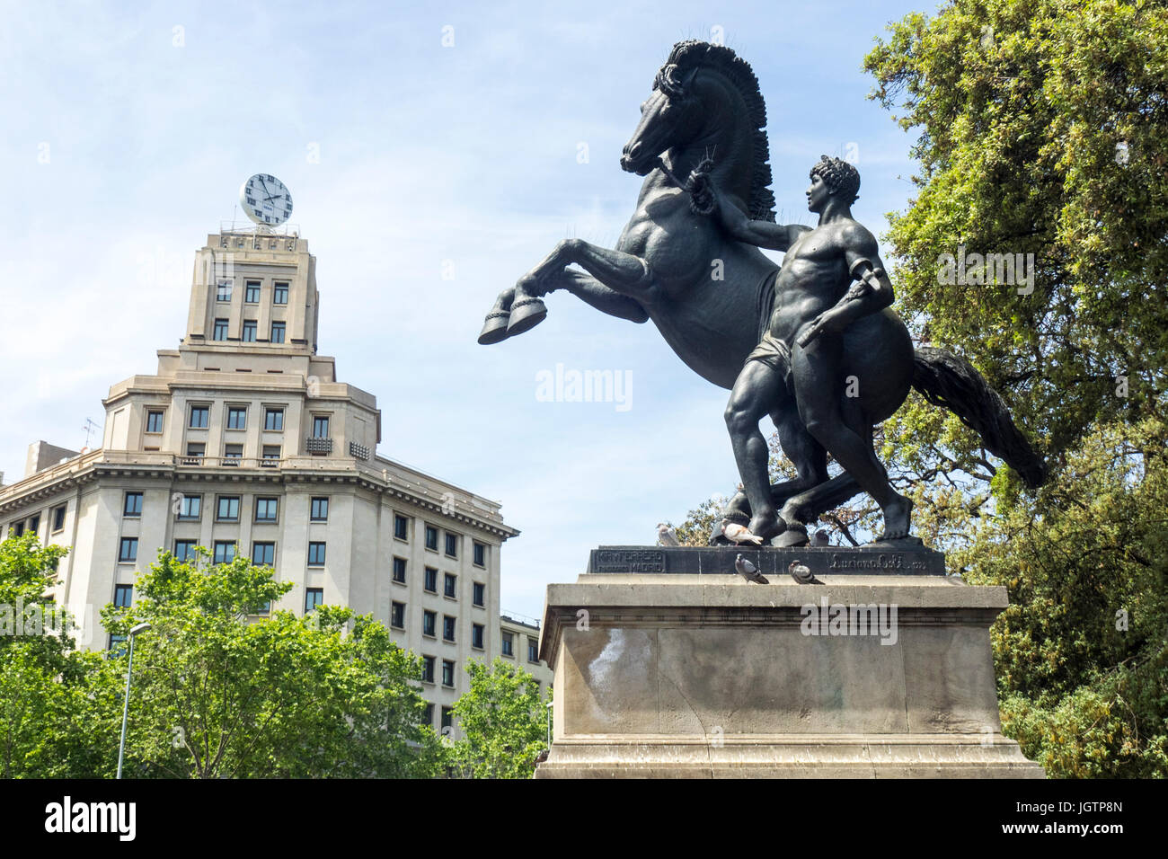 Bronze equestrian sculpture, Treball, by Llucià Oslé at Plaça de Catalunya, Barcelona, Spain. Stock Photo