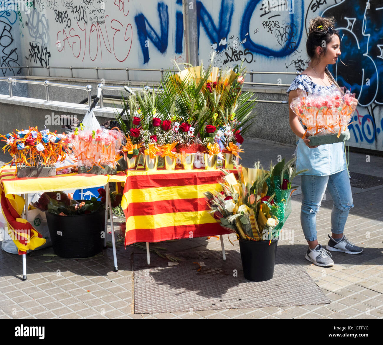 A woman selling red roses on Sant Jordi Day, Barcelona, Spain. Stock Photo