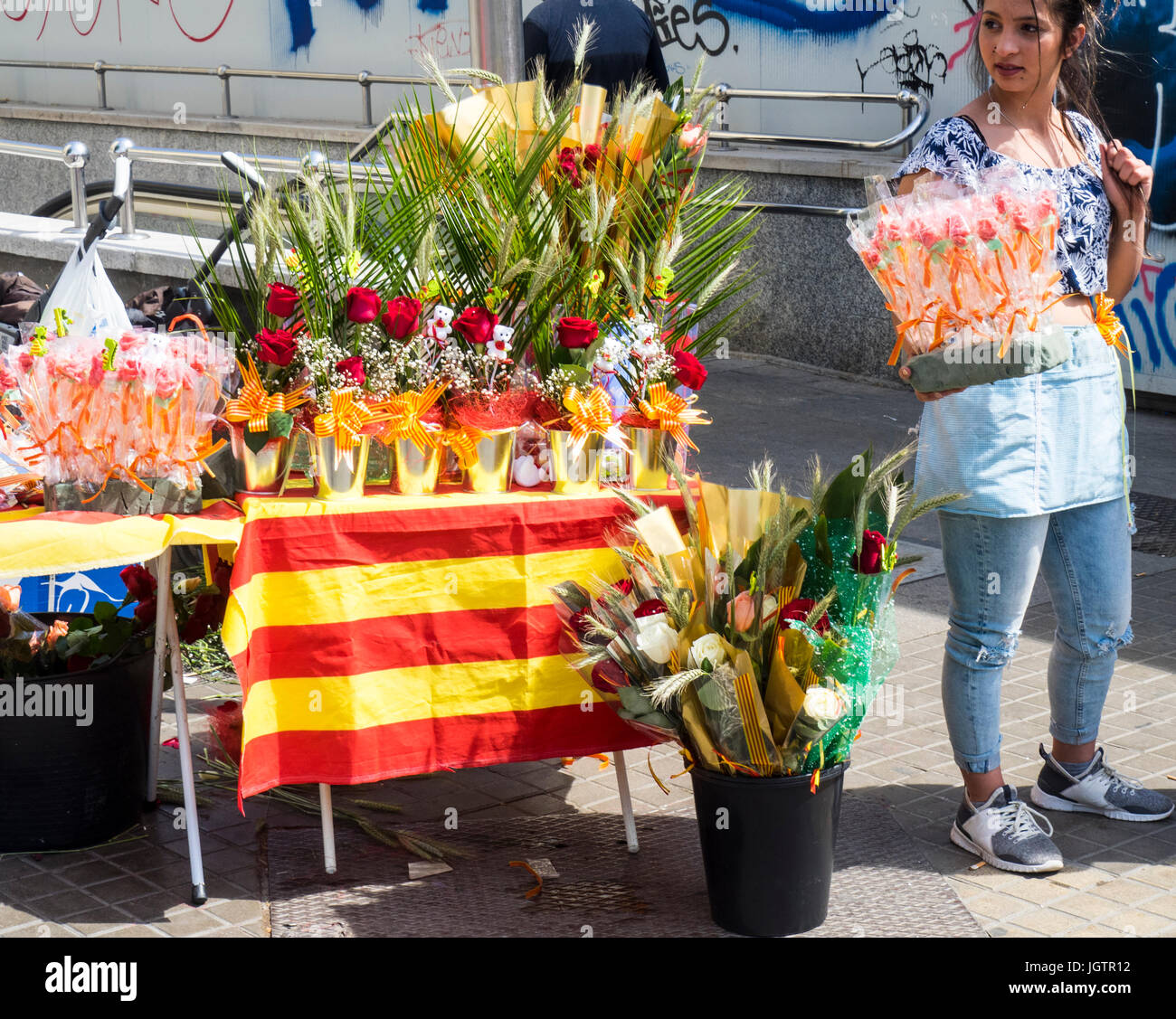 A woman selling red roses on Sant Jordi Day, Barcelona, Spain. Stock Photo