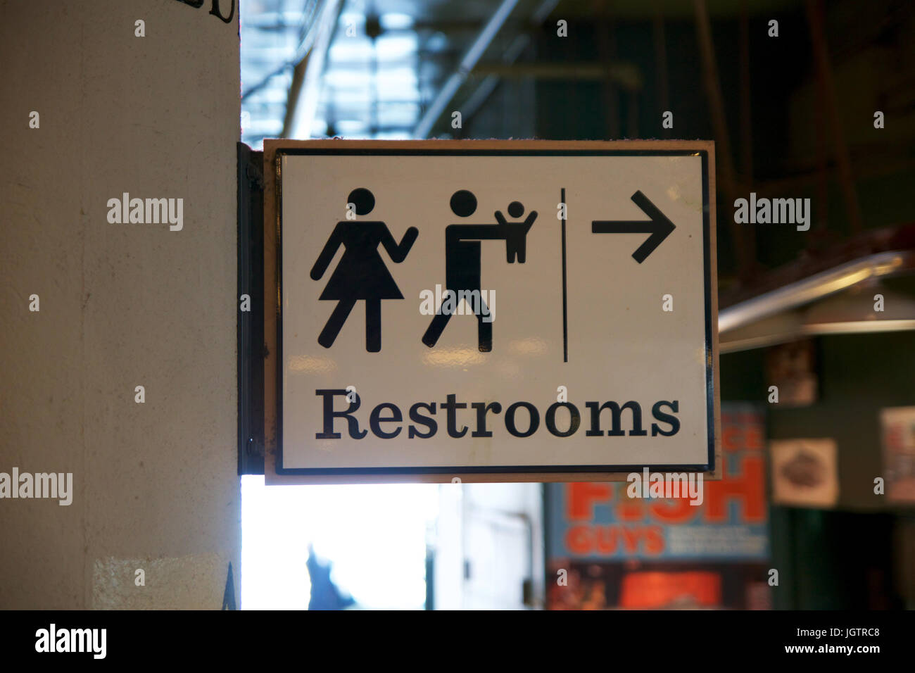 SEATTLE, WASHINGTON, USA - JAN 24th, 2017: a lady and a man toilet sign on white background, way or direction to the restroom at the Pike Place Market Stock Photo