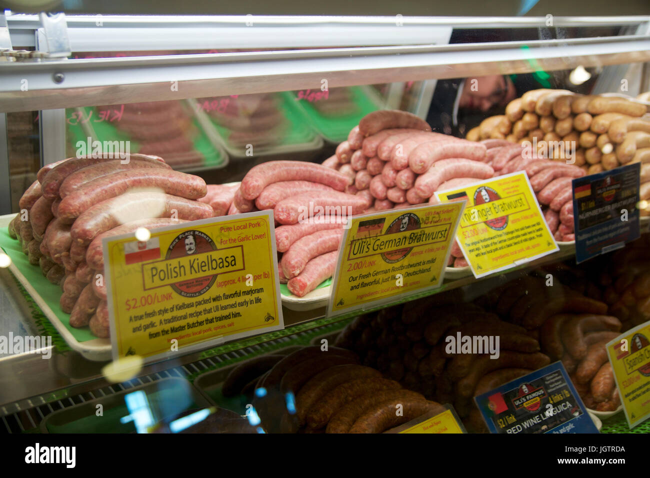 SEATTLE, WASHINGTON, USA - JAN 24th, 2017: Raw pork sausages Bratwurst at Ulis Bierstube at Pike Place Market. This market, opened in 1930, is known for their open air farmers market style Stock Photo