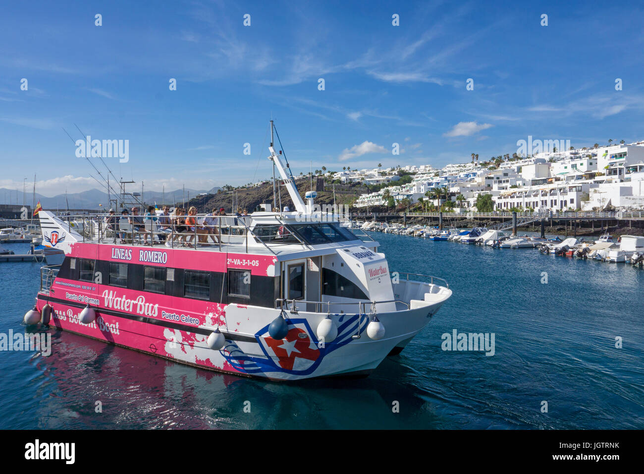 Water Bus Lineas Romero, touristic passenger ship for round trips at fishing harbour La Tinosa, Puerto del Carmen, Lanzarote, Canary islands, Europe Stock Photo