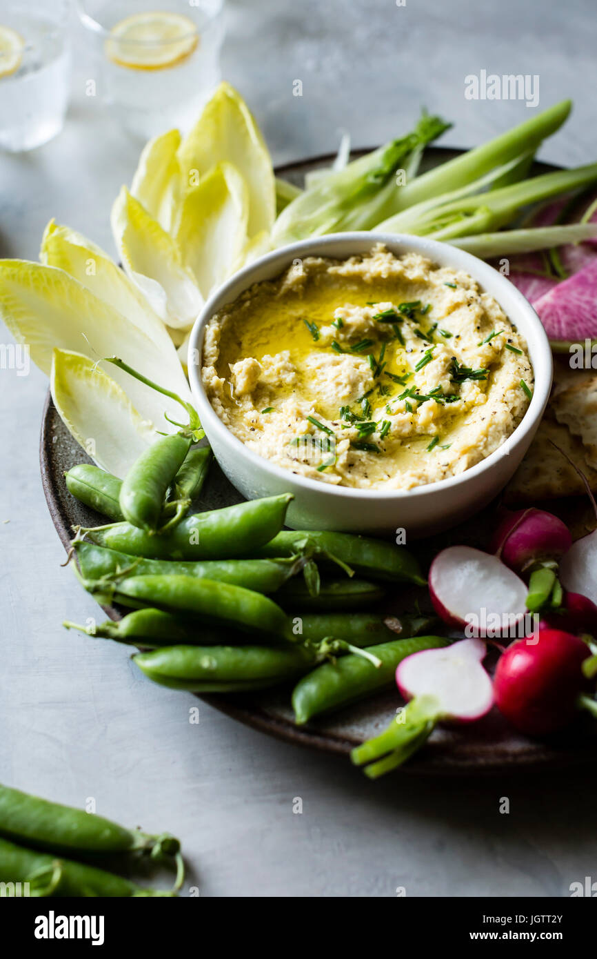 Spring vegetables and hummus on a platter Stock Photo Alamy