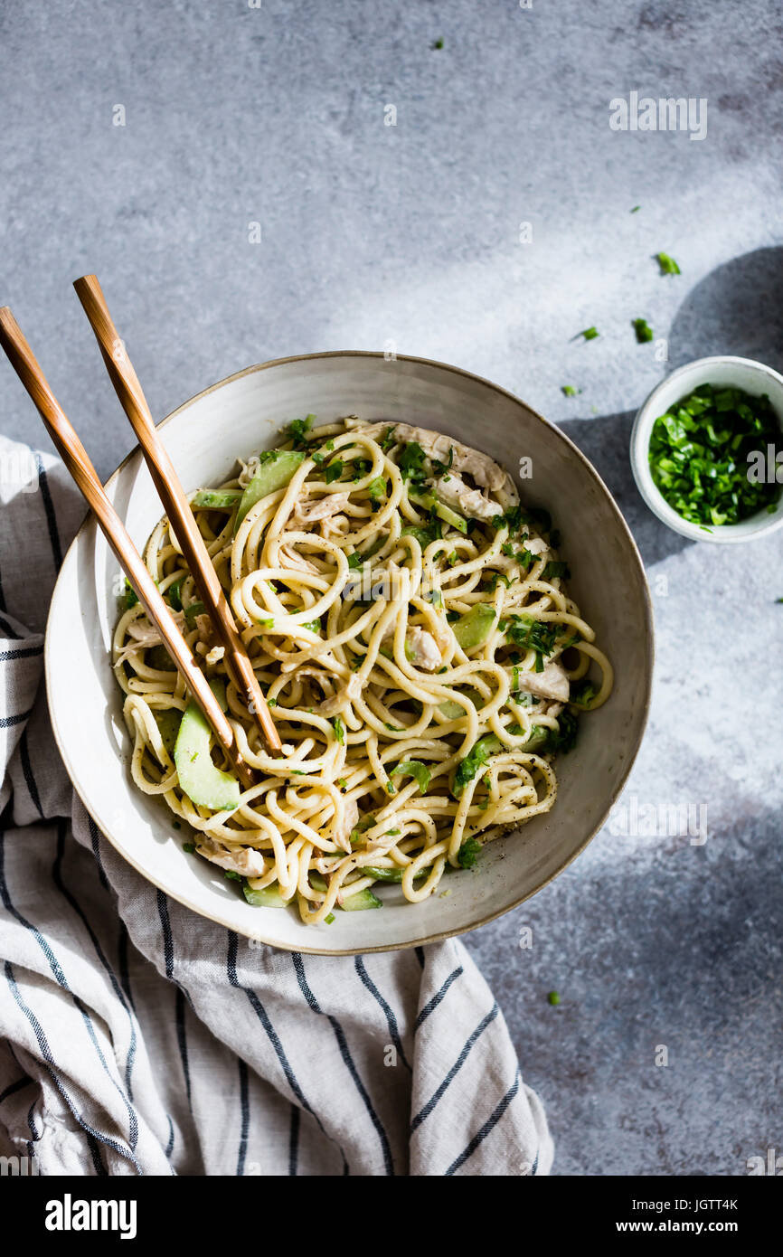 An Asian noodle salad in a ceramic bowl Stock Photo