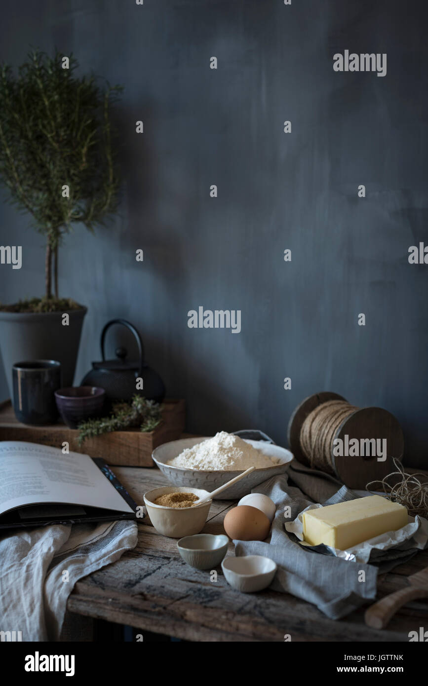 Butter, brown sugar and flour ingredients on a rustic table Stock Photo