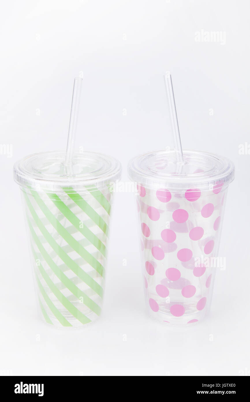 Green And Pink Plastic Tumblers On A White Surface Tumblers Isolated On White Background Stock 1012