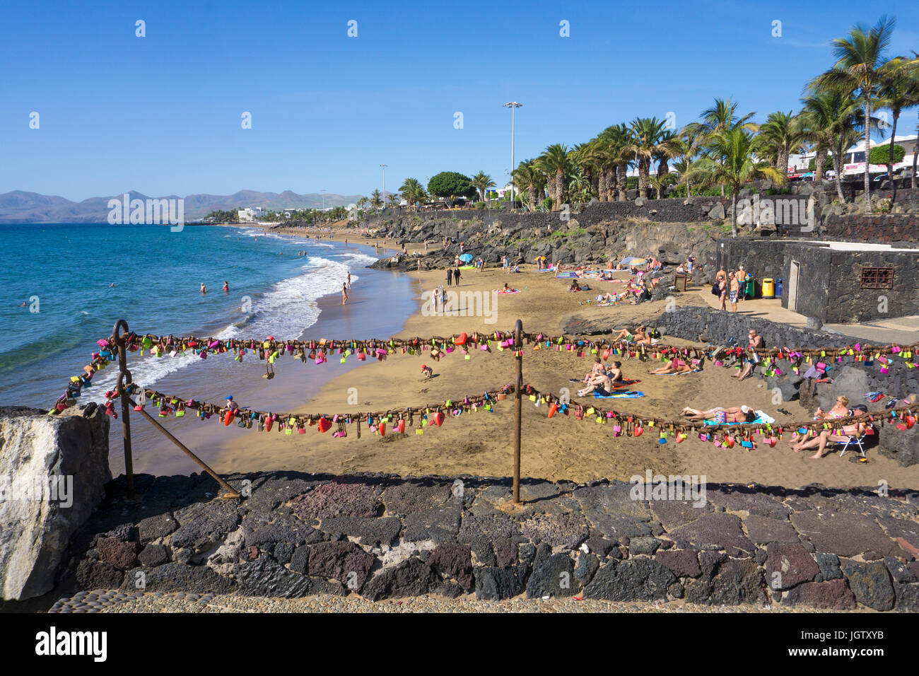 Love lockers hanging on chains, Playa Grande, large beach at Puerto del Carmen, Lanzarote island, Canary islands, Spain, Europe Stock Photo