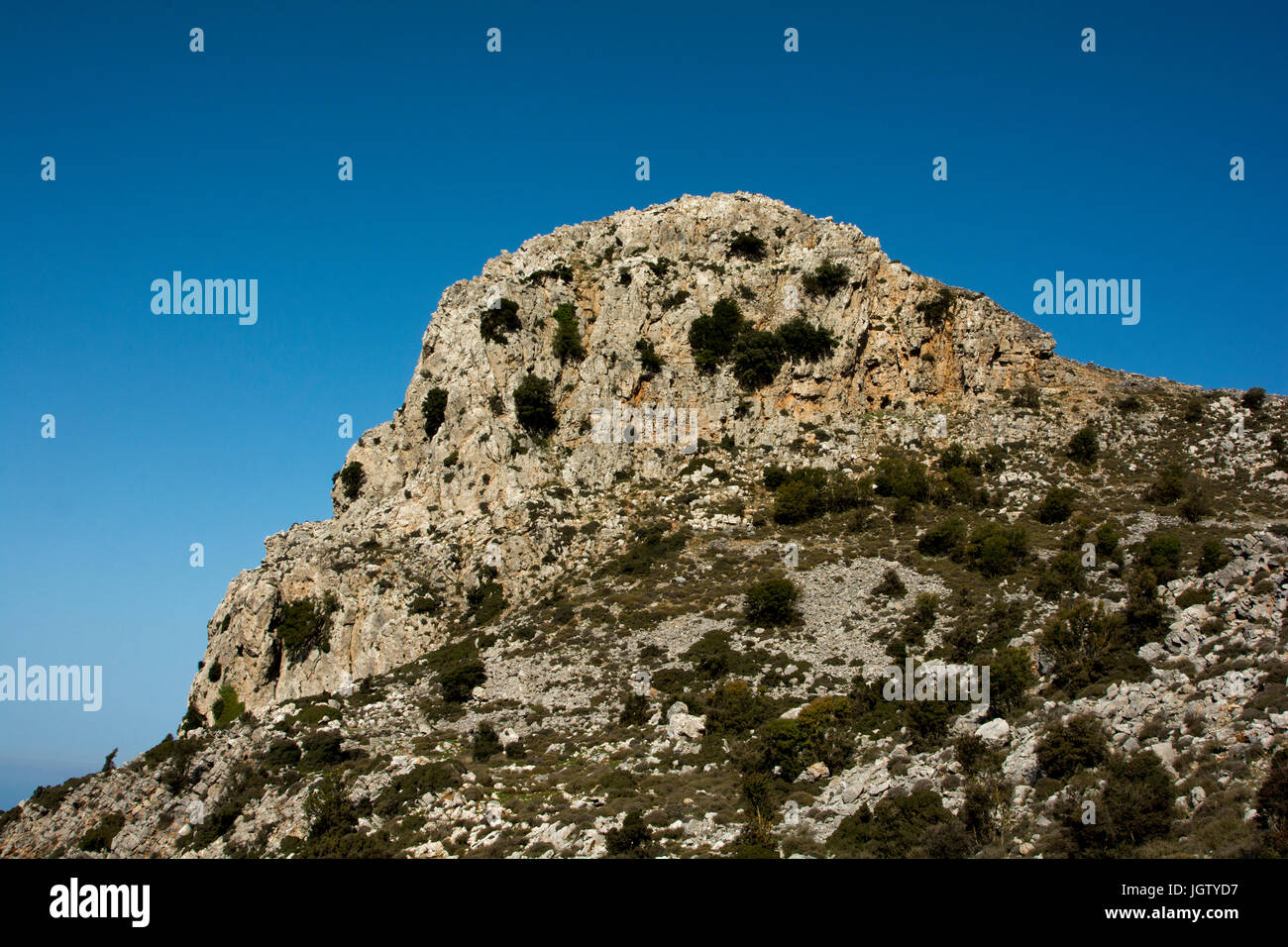 Karfi is a 1117 meter high characteristic summit at the north of the Lasithi plateau in Crete. Stock Photo