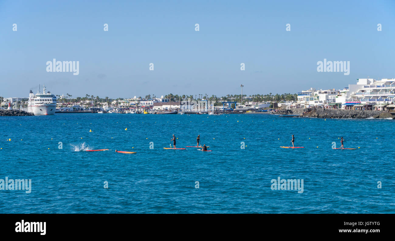Stand-up Paddling at Playa Blanca, Lanzarote island, Canary islands, Spain, Europe Stock Photo