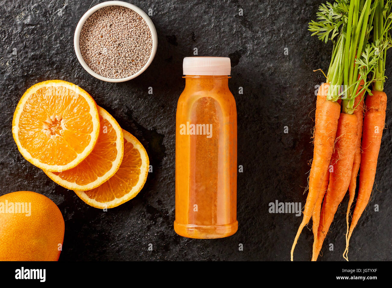 Fresh vegetable and fruit smoothie for a healthy diet made with orange, carrots and chia seeds