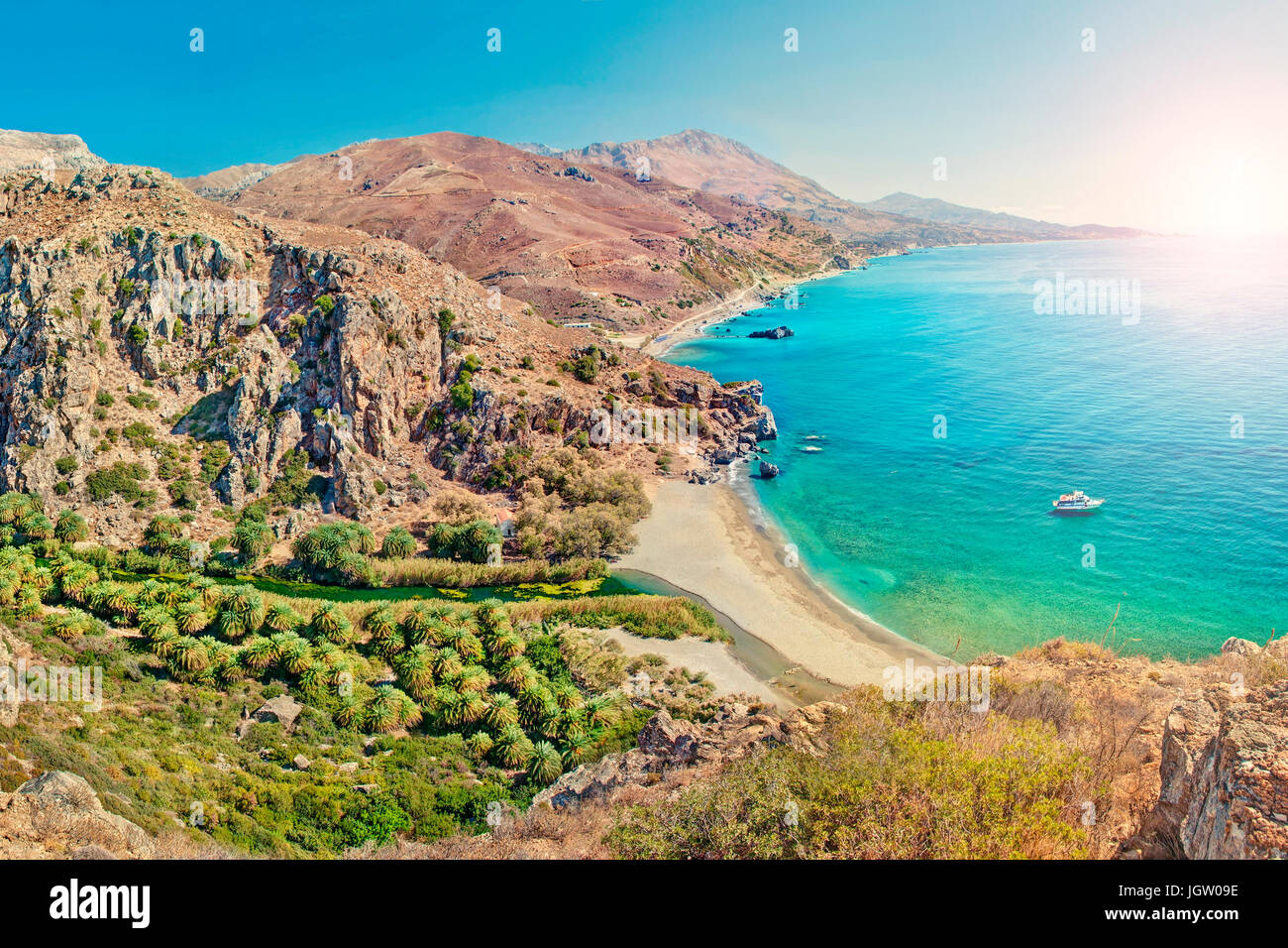 aerial view of palm tree forest and beach of Preveli surrounded by