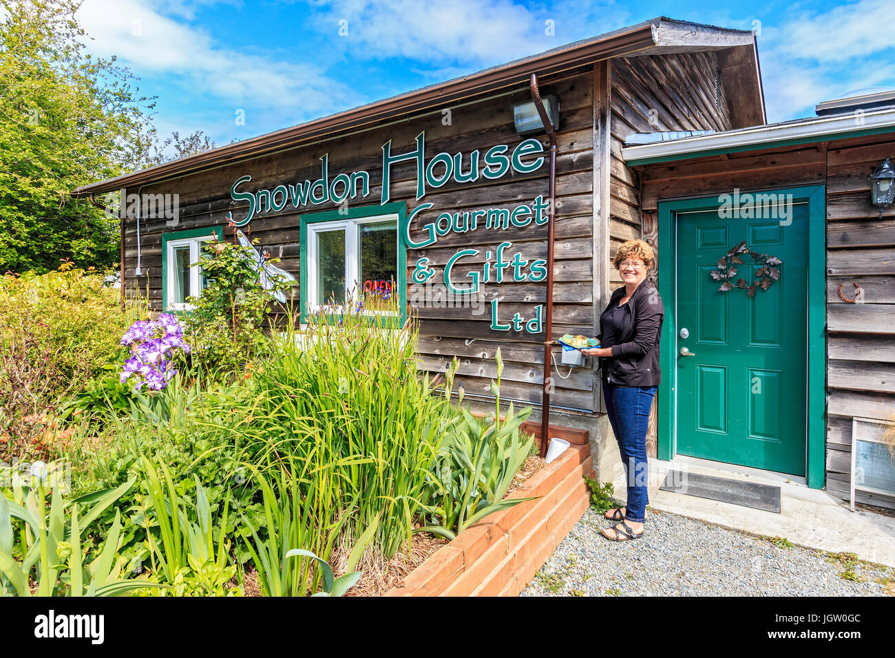 Laura Waters at her shop, Snowdon House outside Victoria, BC, Canada on Vancouver Island, where she sells edibles made from new growth on douglas fir Stock Photo