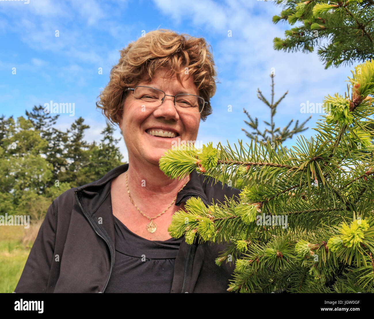 Laura Waters at her shop, Snowdon House outside Victoria, BC, Canada on Vancouver Island, where she sells edibles made from new growth on douglas fir  Stock Photo