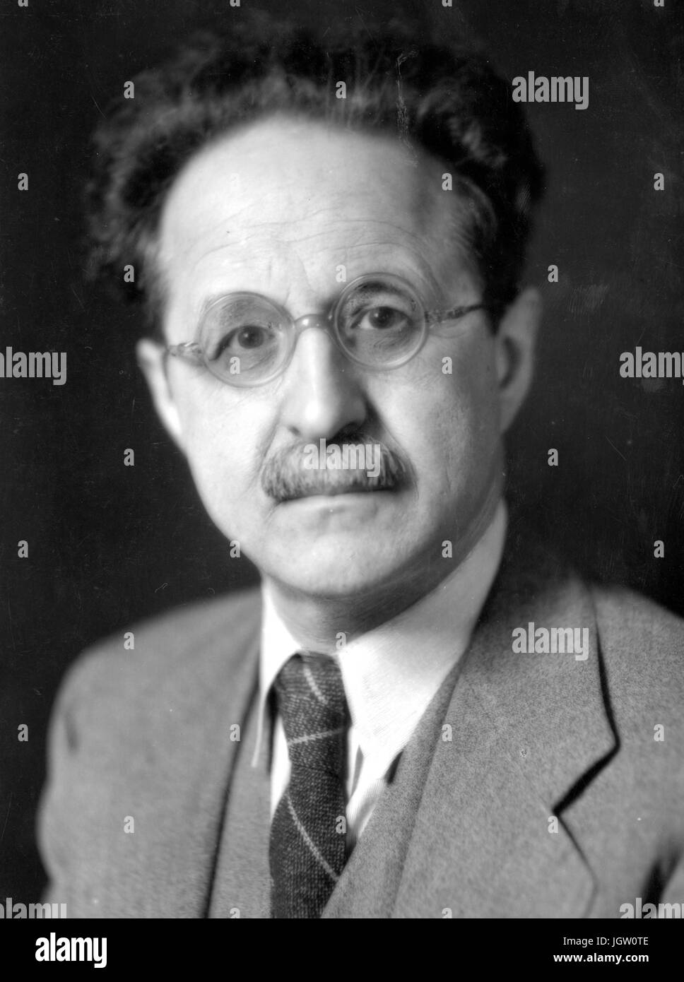 Shoulders up portrait of German studies scholar and professor Ernst Feise, 1940. Stock Photo