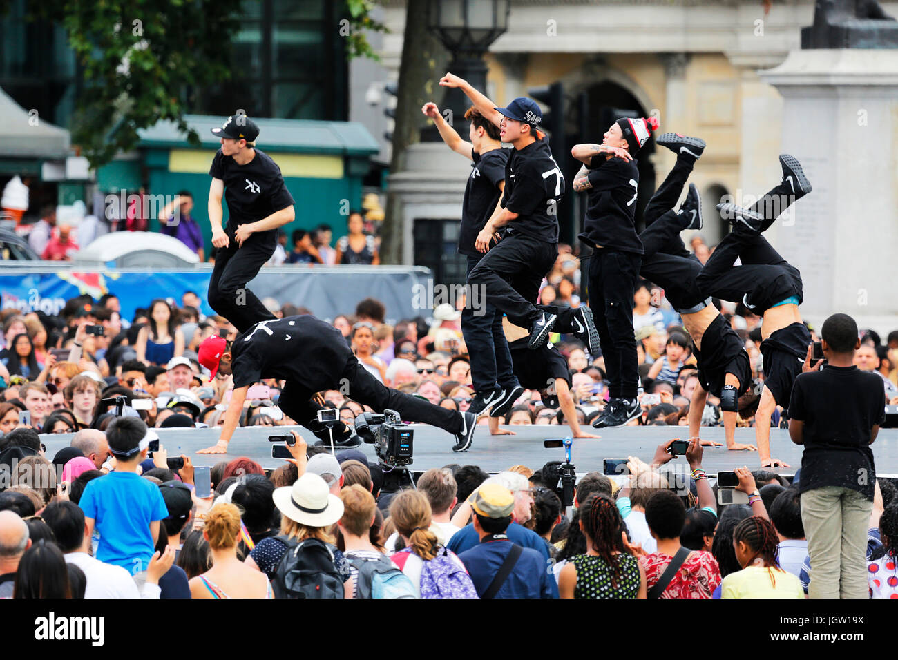 London, UK - August 9, 2015: A group of Korean hip hop dancers showing performance in the Korean Festival at Trafalgar Square, spectators present. Stock Photo