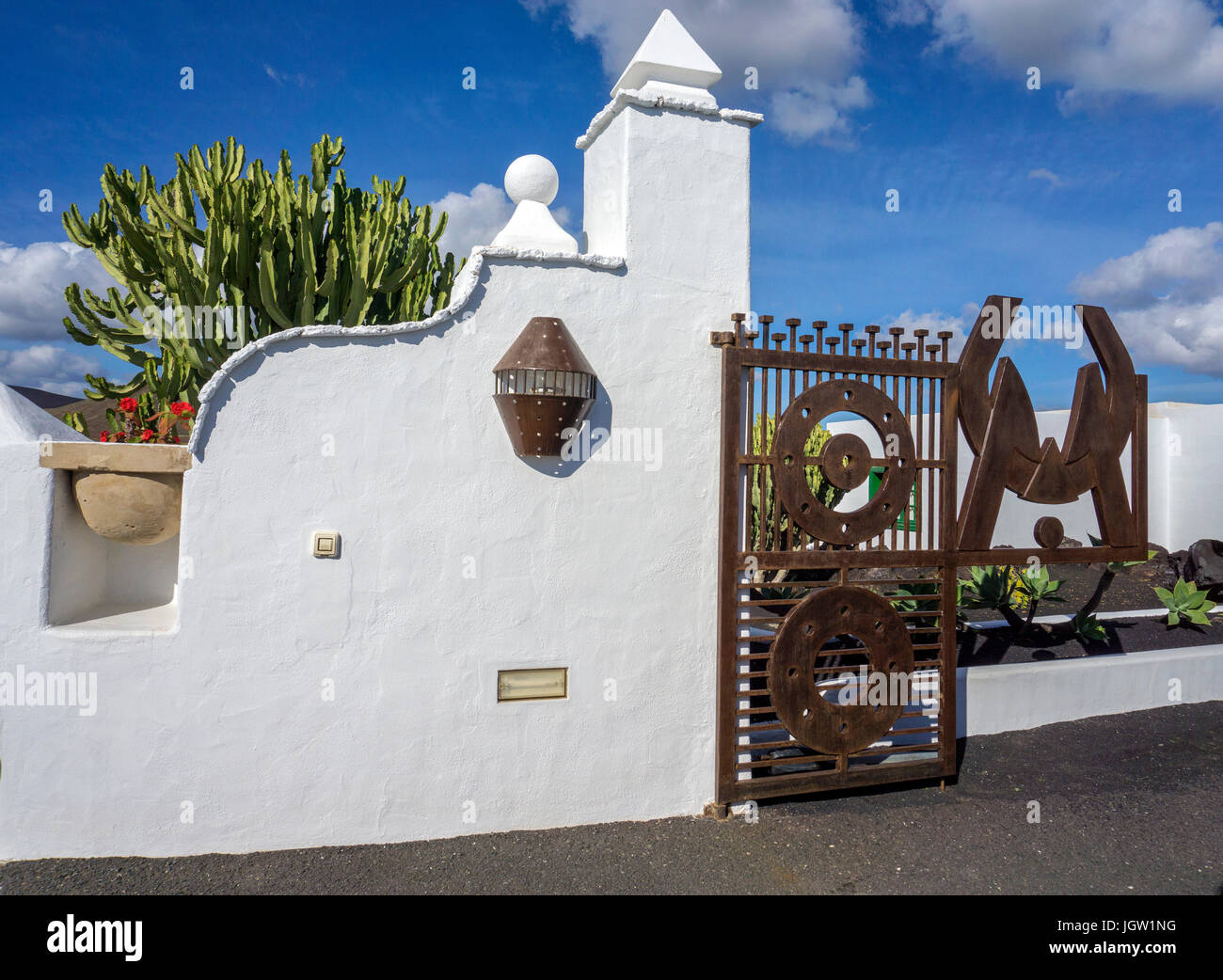 Iron gate with Logo of Cesar Manrique, entrance to Fundacion Cesar Manrique, Taro de Tahiche, Tahiche, Lanzarote, Canary islands, Spain, Europe Stock Photo