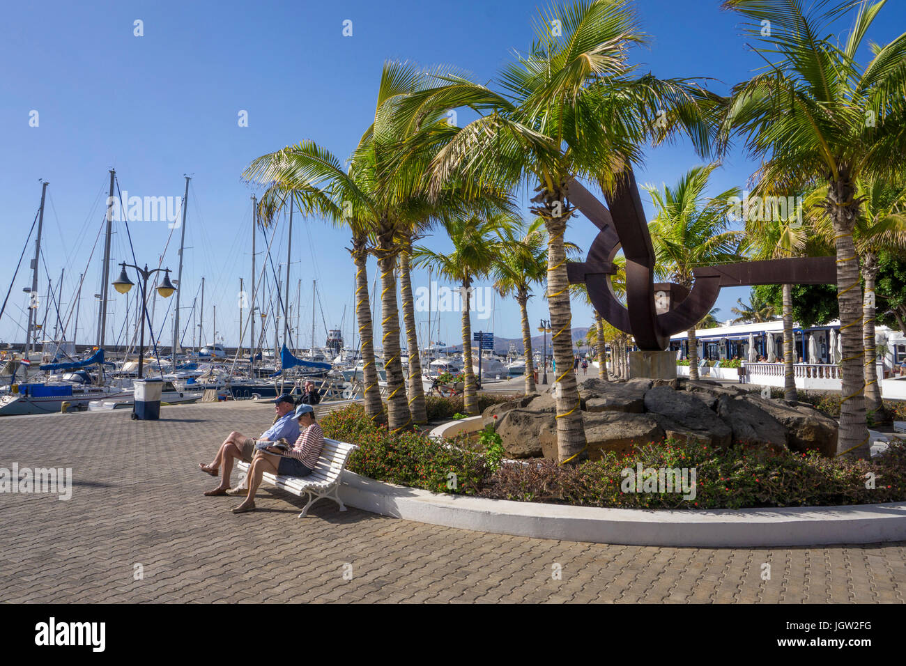 People at harbour promenade, Yacht harbour, Puerto Calero, Lanzarote island, Canary islands, Spain, Europe Stock Photo