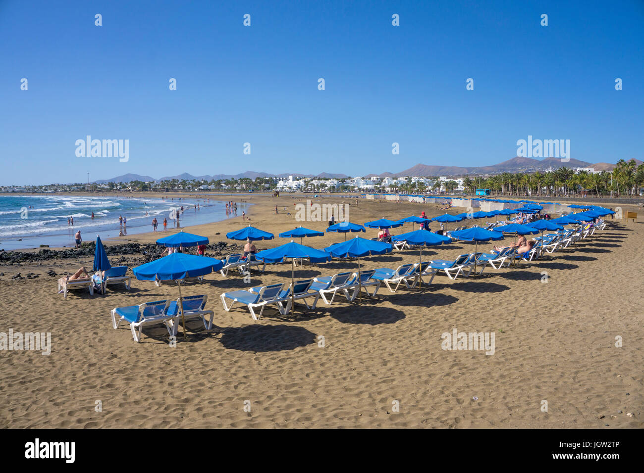 Sunbeds and parasols at Playa Matagorda, large beach at Matagorda, Puerto  del Carmen, Lanzarote island, Canary islands, Spain, Europe Stock Photo -  Alamy