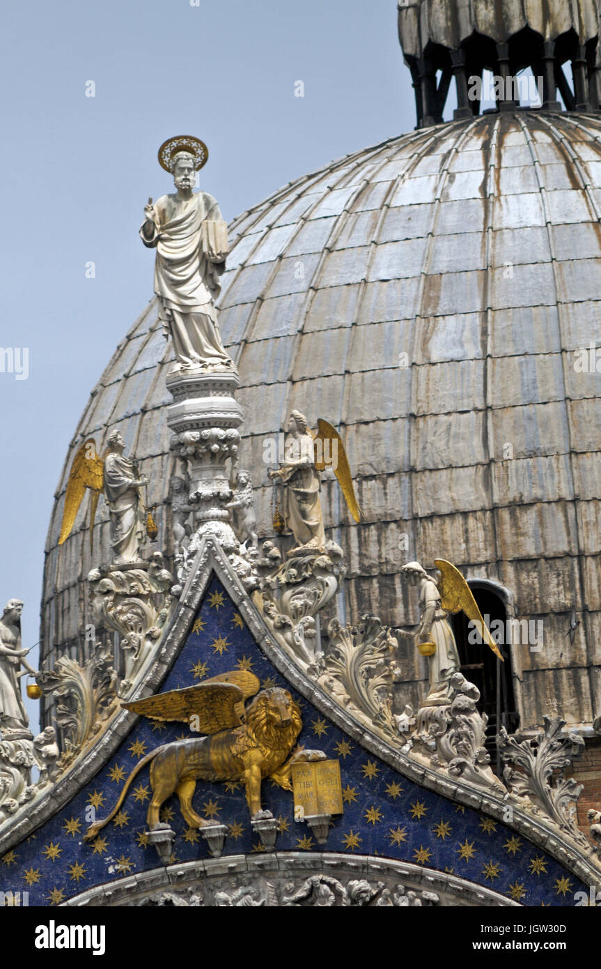 The Patriarchal Cathedral Basilica of Saint Mark, Venice. Detail of the gable showing Venice's patron apostle St. Mark with angels. Stock Photo