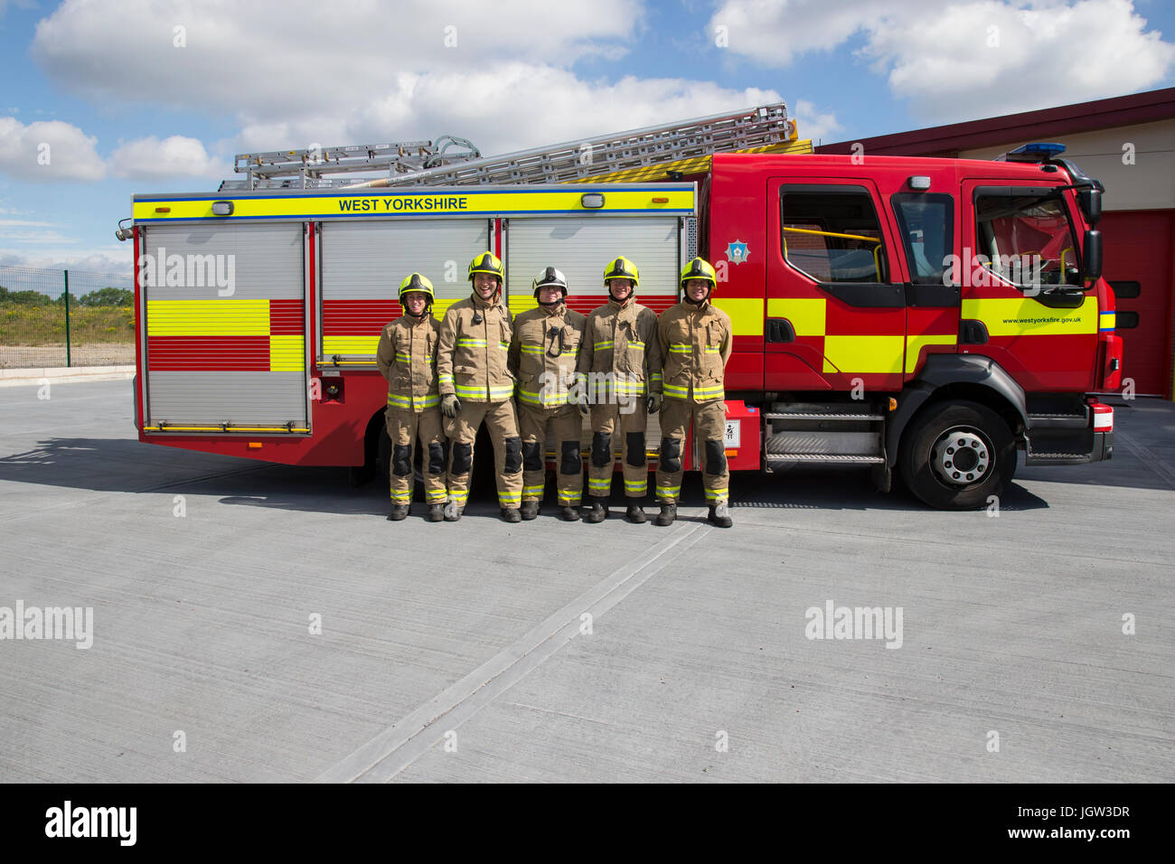 UK firefighting crew with fire engine Stock Photo Alamy