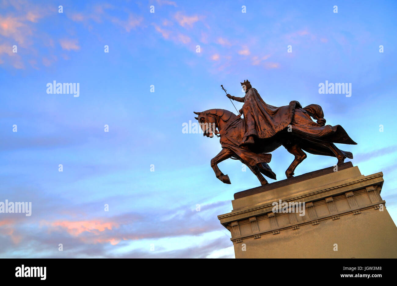 The sunset over the Apotheosis of St. Louis statue of King Louis IX of ...