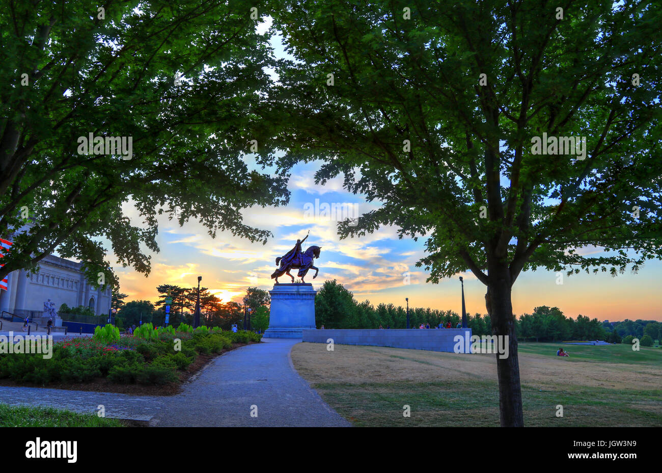 The sunset over the Apotheosis of St. Louis statue of King Louis IX of France, namesake of St. Louis, Missouri in Forest Park, St. Louis, Missouri. Stock Photo