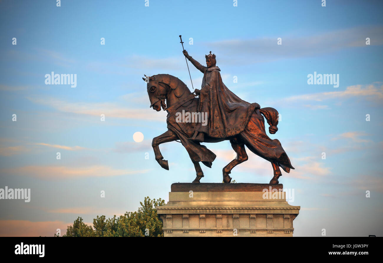 The moon over the Apotheosis of St. Louis statue of King Louis IX of France, namesake of St. Louis, Missouri in Forest Park, St. Louis, Missouri. Stock Photo