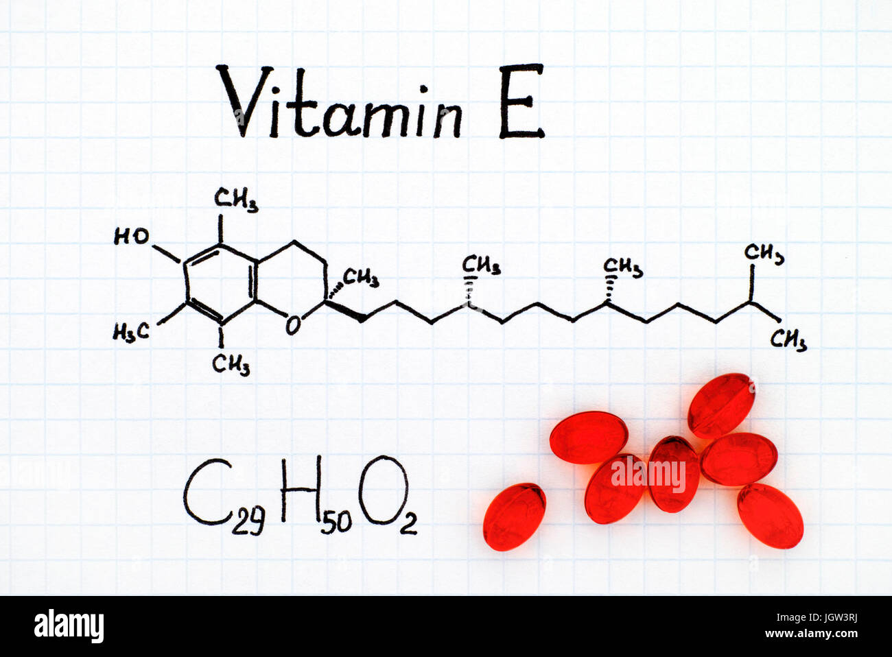 Chemical formula of Vitamin E and red pills Stock Photo - Alamy