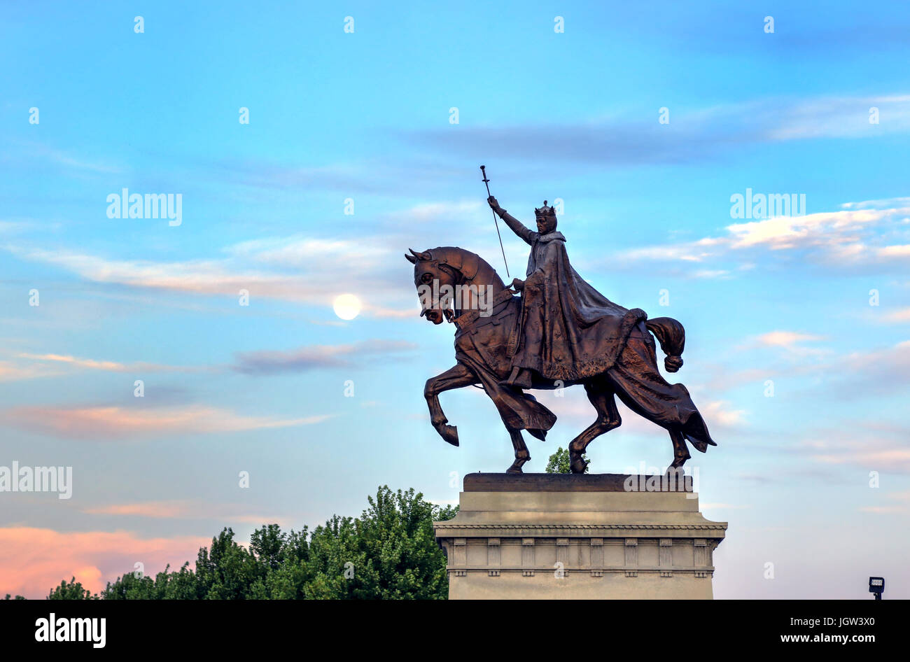 The moon over the Apotheosis of St. Louis statue of King Louis IX of France, namesake of St. Louis, Missouri in Forest Park, St. Louis, Missouri. Stock Photo