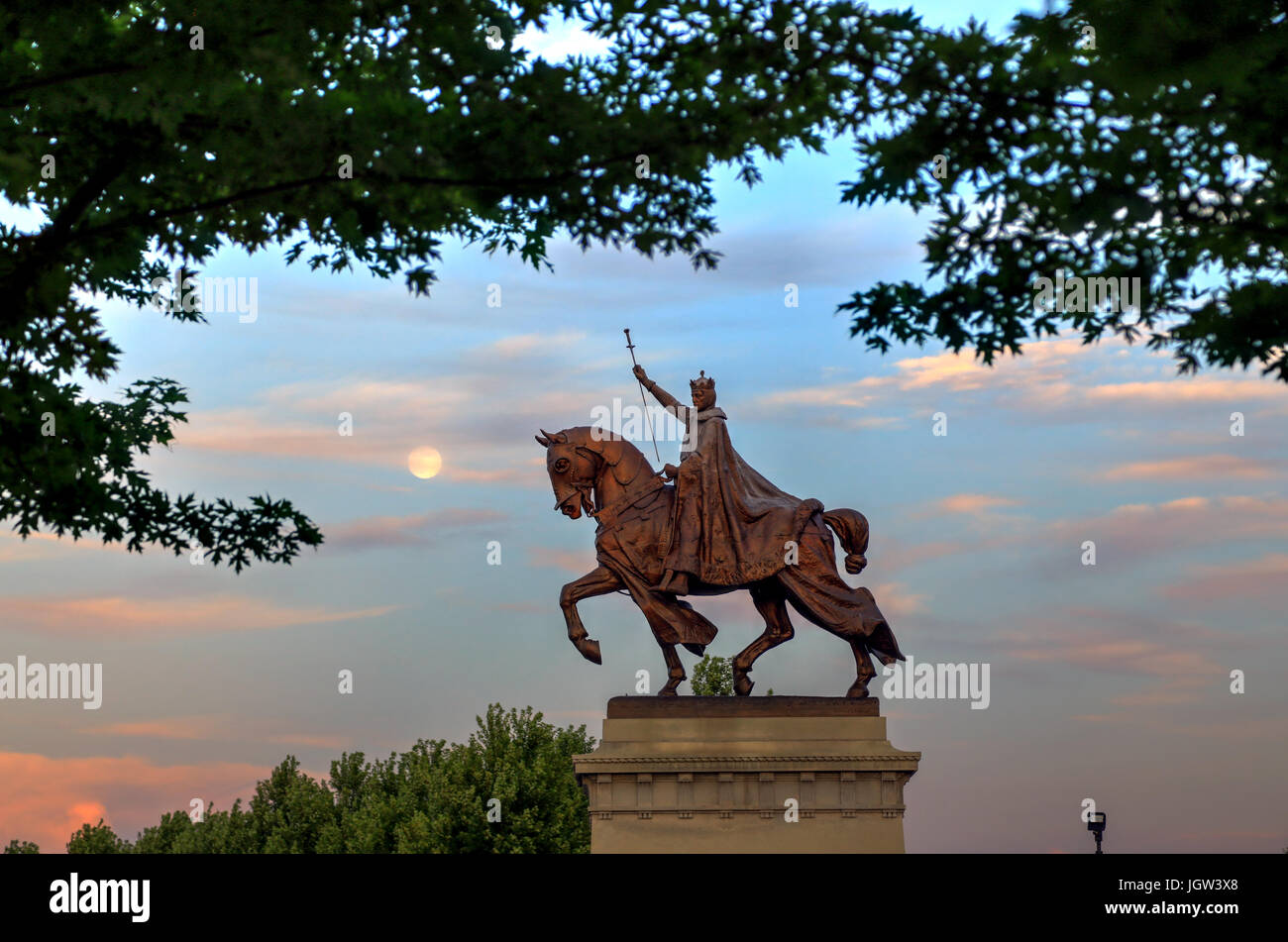 The moon over the Apotheosis of St. Louis statue of King Louis IX of France, namesake of St. Louis, Missouri in Forest Park, St. Louis, Missouri. Stock Photo