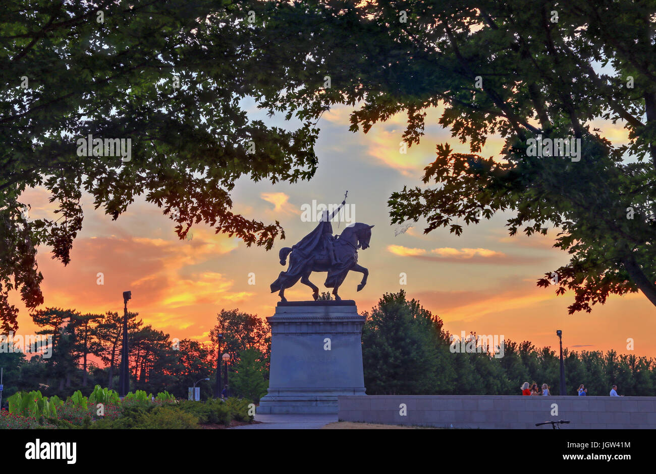 The sunset over the Apotheosis of St. Louis statue of King Louis IX of France, namesake of St. Louis, Missouri in Forest Park, St. Louis, Missouri. Stock Photo