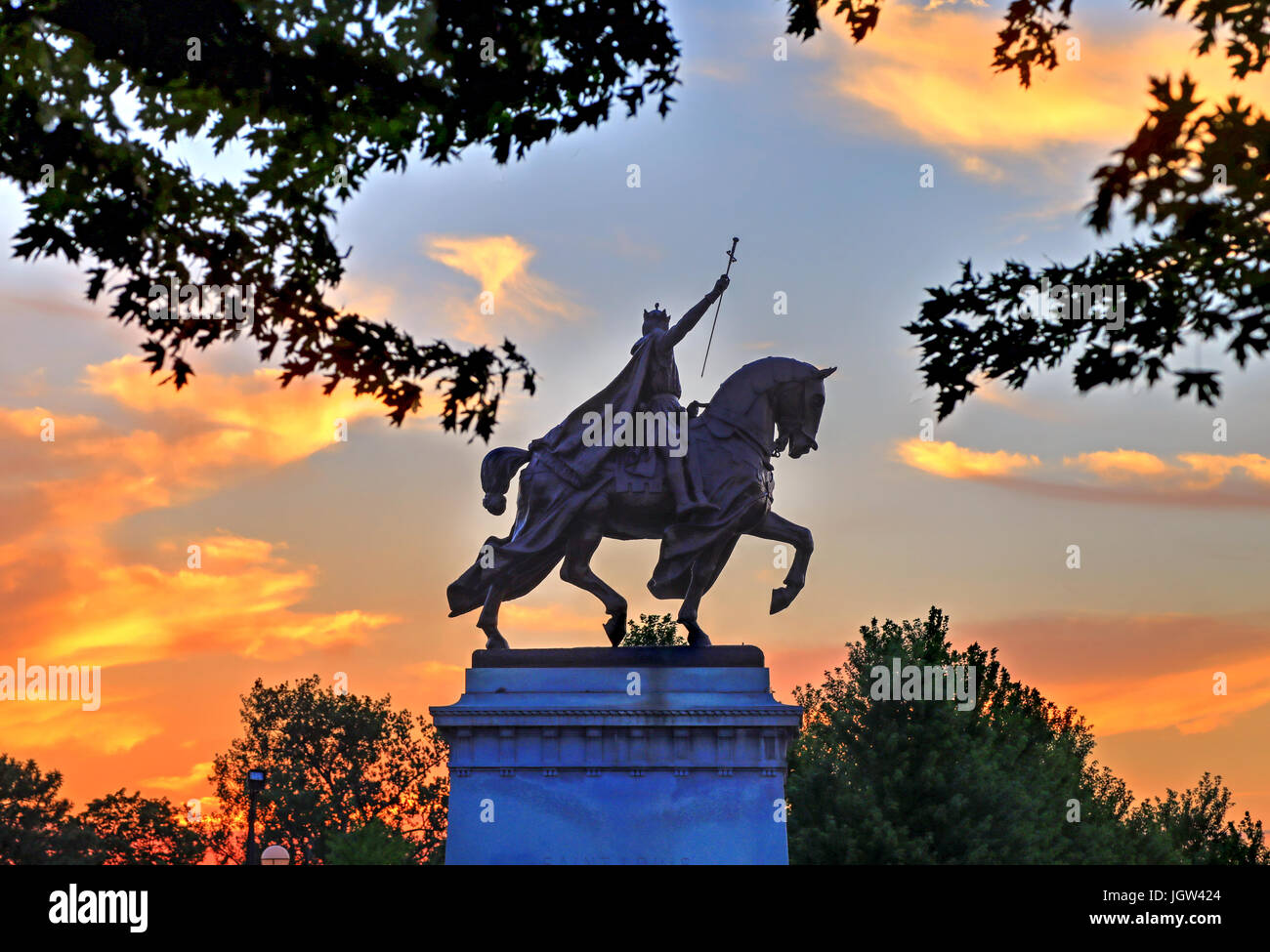 The sunset over the Apotheosis of St. Louis statue of King Louis IX of France, namesake of St. Louis, Missouri in Forest Park, St. Louis, Missouri. Stock Photo