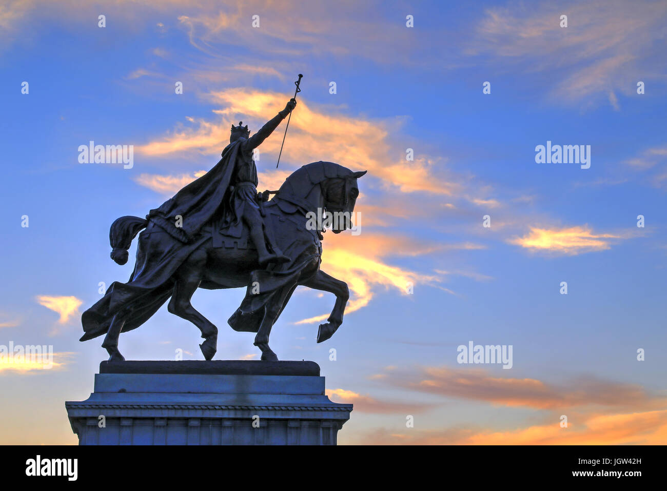 The sunset over the Apotheosis of St. Louis statue of King Louis IX of France, namesake of St. Louis, Missouri in Forest Park, St. Louis, Missouri. Stock Photo