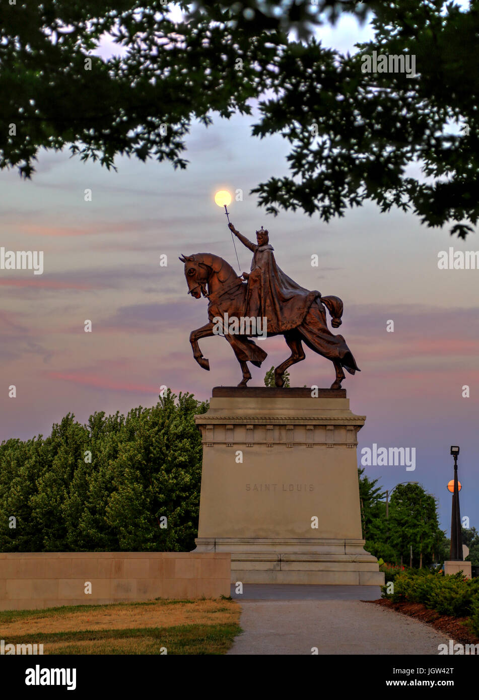 The moon over the Apotheosis of St. Louis statue of King Louis IX of France, namesake of St. Louis, Missouri in Forest Park, St. Louis, Missouri. Stock Photo