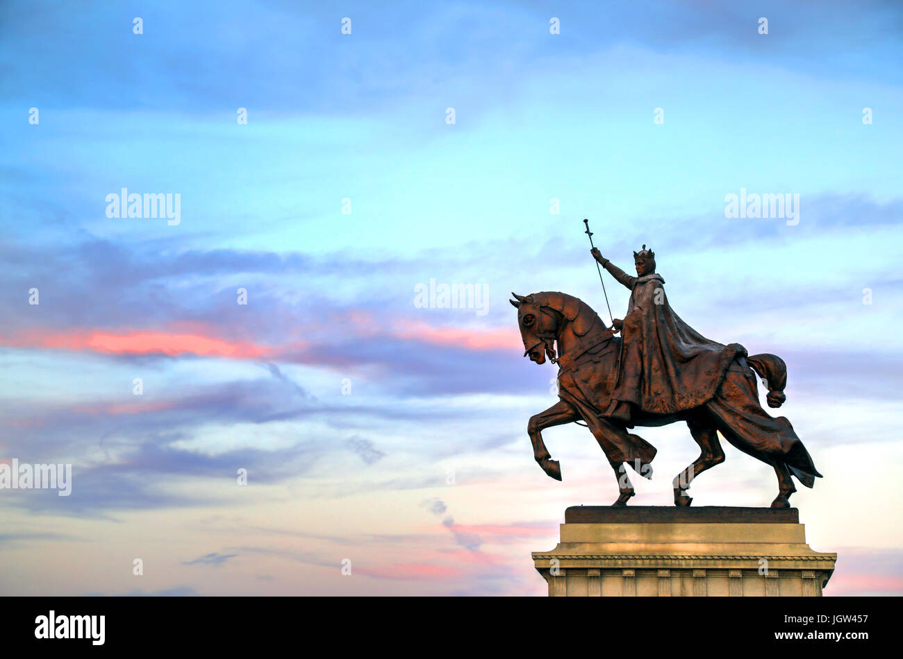 The sunset over the Apotheosis of St. Louis statue of King Louis IX of France, namesake of St. Louis, Missouri in Forest Park, St. Louis, Missouri. Stock Photo