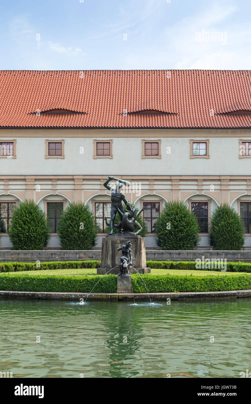 Pool, statue and building at the Wallenstein Garden. It is a public Baroque garden at the Lesser Town (Mala Strana) in Prague. Viewed from the front. Stock Photo