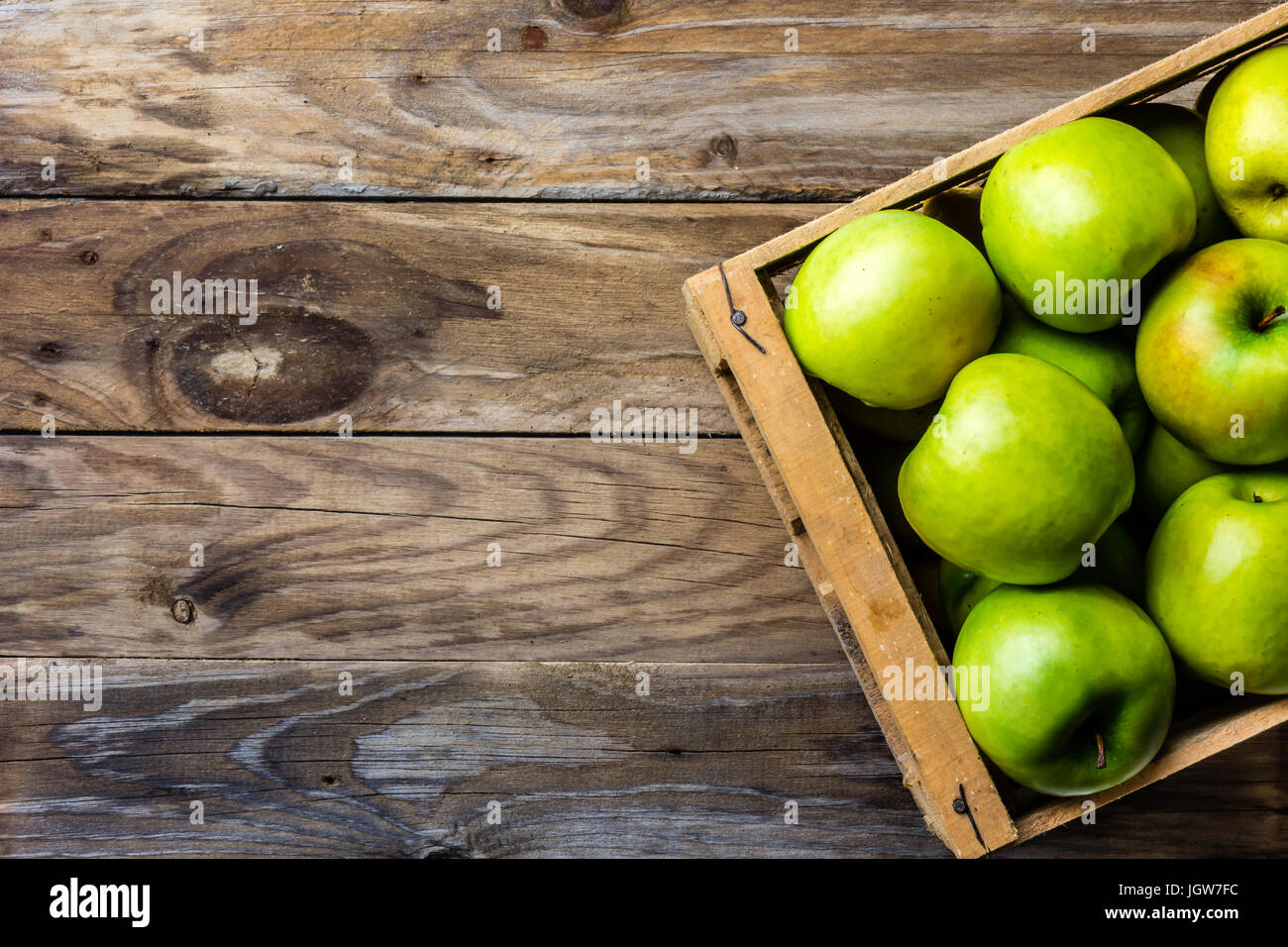 Box of fresh green apples. Harvest concept. Top view Stock Photo