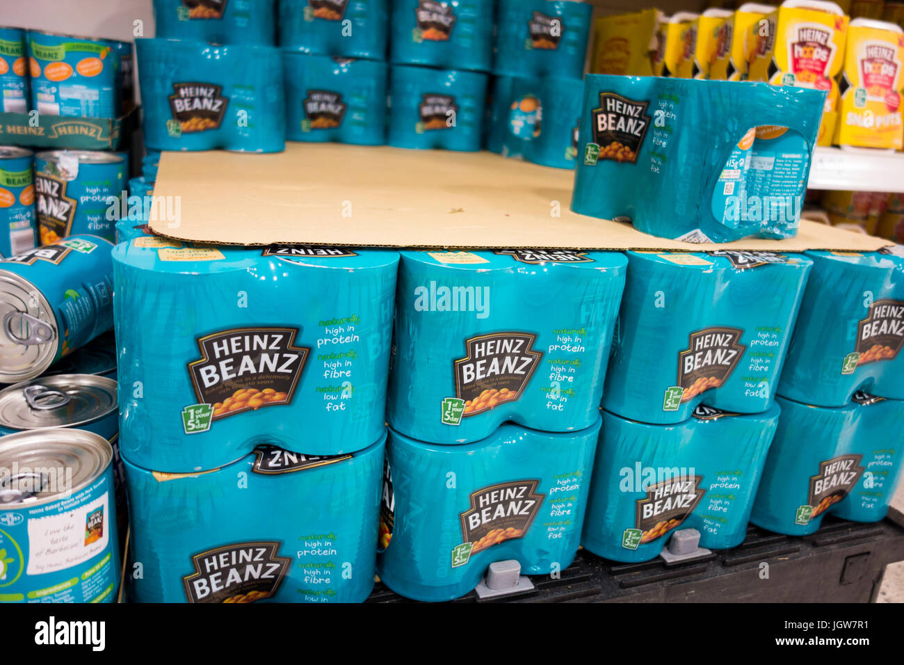Multi pack cans of Heinz baked beans for sale on a supermarket shelf in the UK Stock Photo