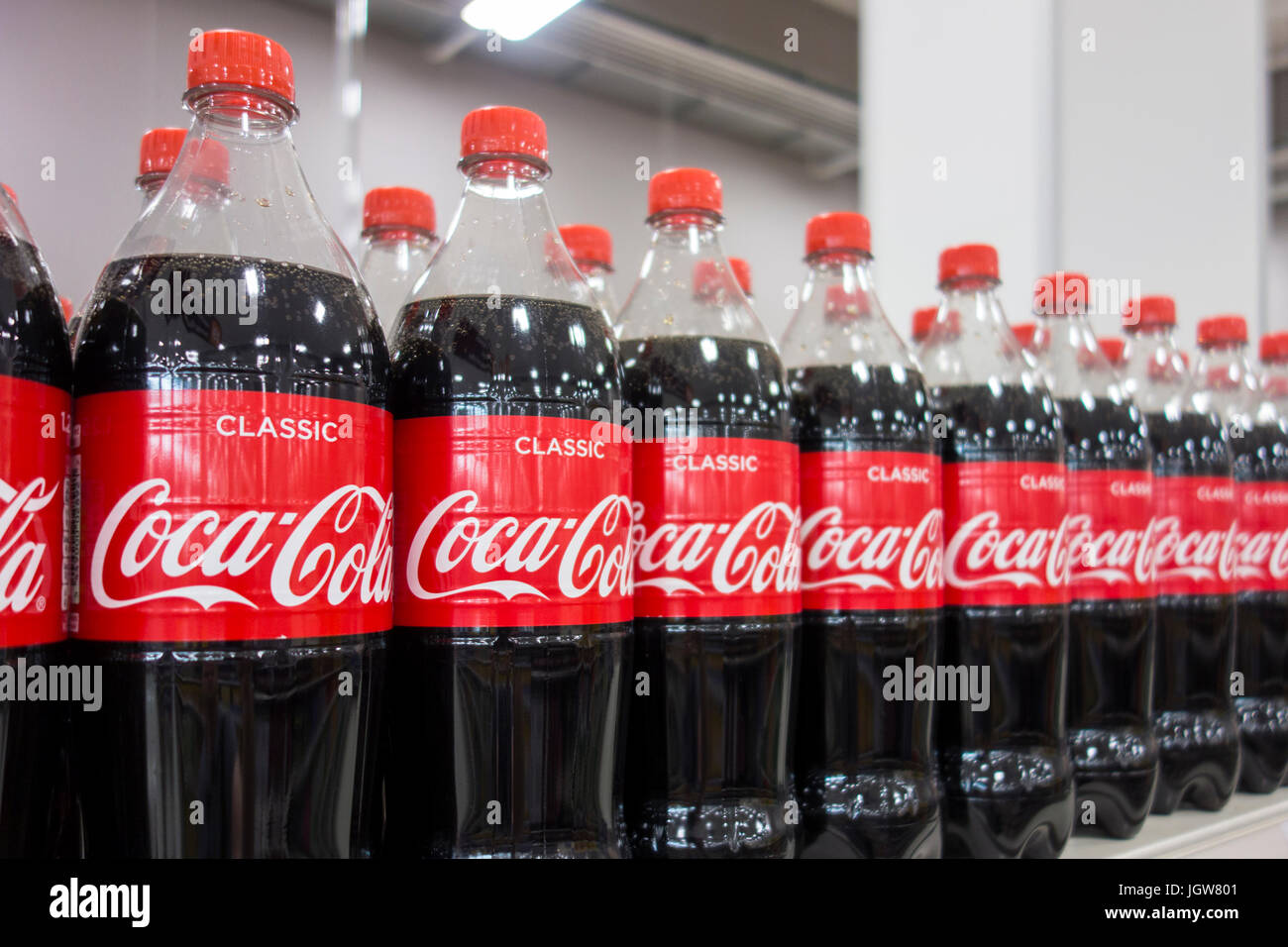 Bottles of Coca Cola / Coke for sale on a supermarket shelf in the UK