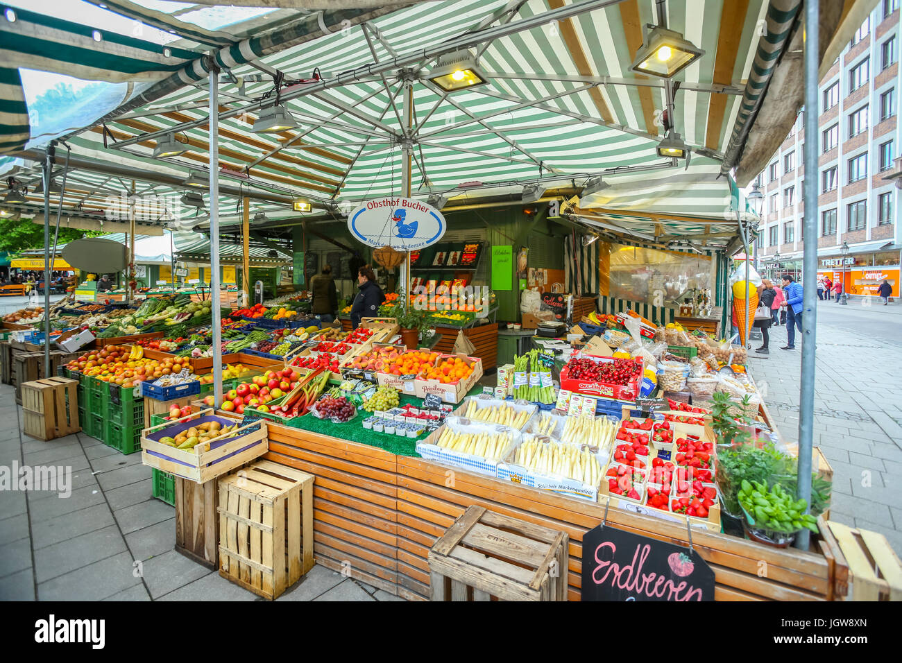 MUNICH, GERMANY MAY 9, 2017 People buying fruit and vegetable at