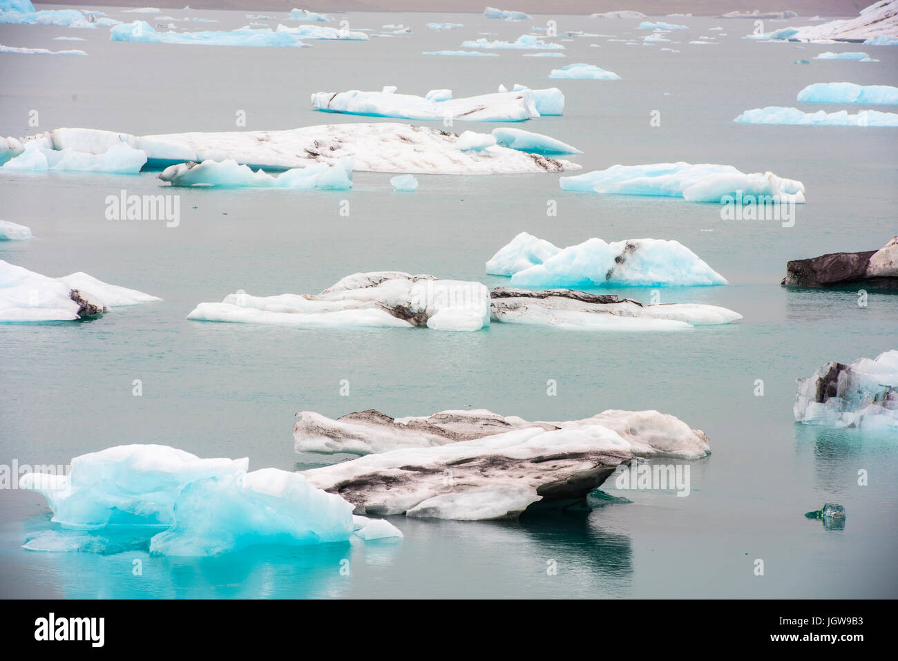 Cracking ice floating on lake Stock Photo Alamy