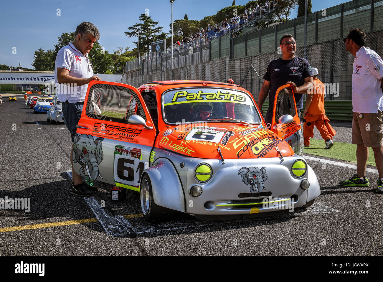 Italian Bicilindriche Cup, Red and silver Fiat 500 racing car on starting grid with mechanic Stock Photo